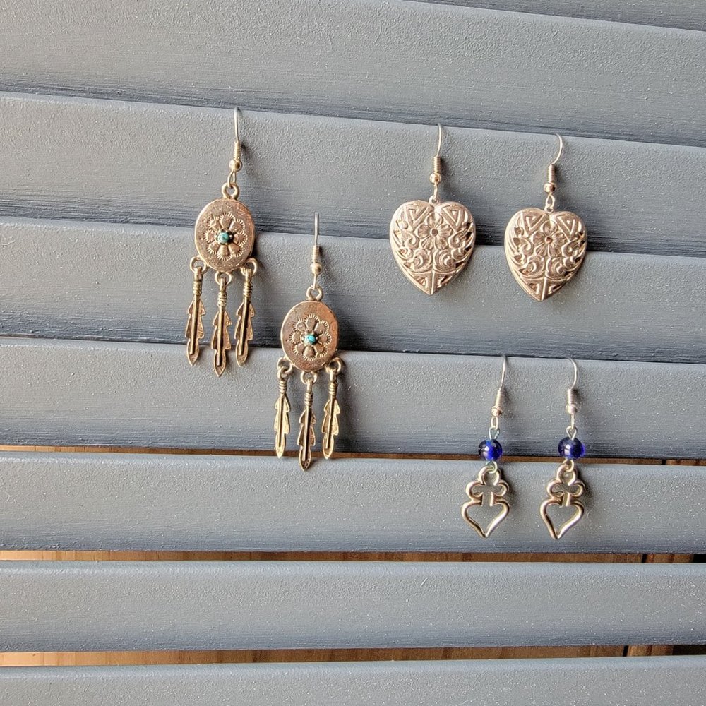 Three pair of silver dangle costume earrings